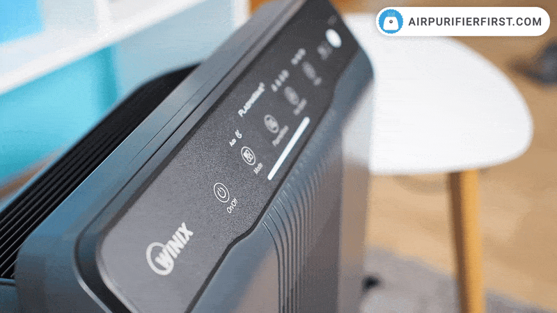 Opening and closing a front cover on the Winix 5500-2.