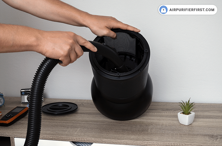 The next step is to vacuum the inside of the appliance with a vacuum cleaner to remove excess dust particles.